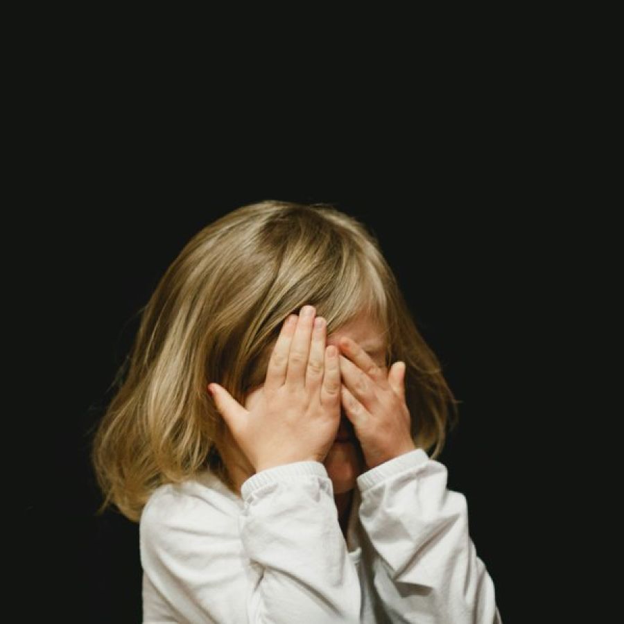 young-girl-hiding-face